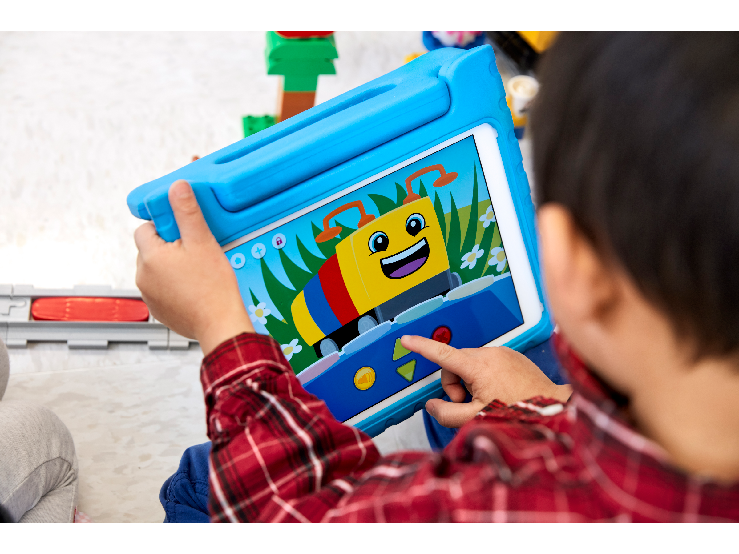 Preschool boy developing his coding skills with the app for Coding Express by LEGO Education